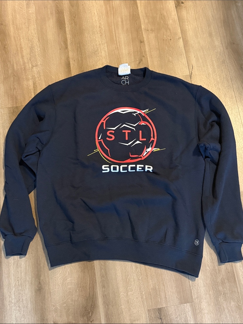 Champion Navy STL Soccer Crewneck Sweatshirt with Red & Yellow Graphic